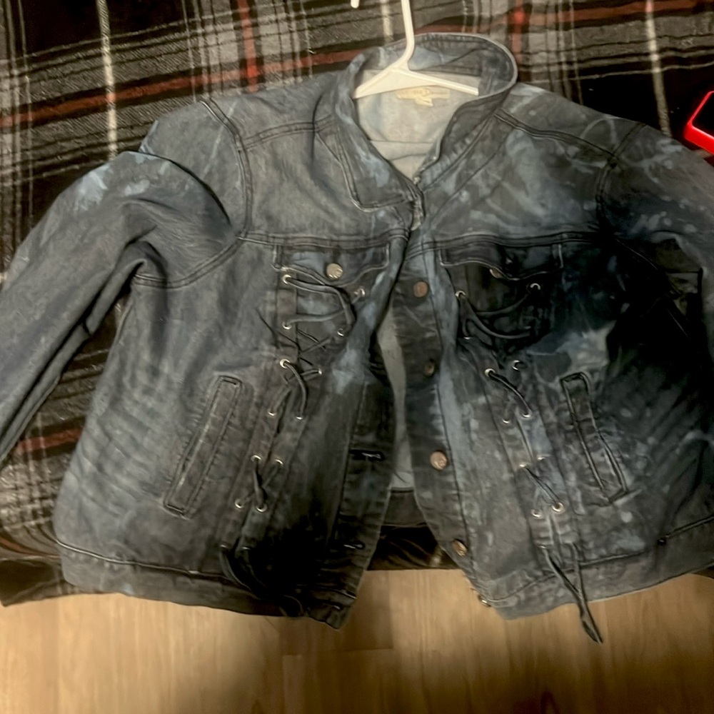 Selling a gently used Est. 1946 Denim jacket with lace up panels.